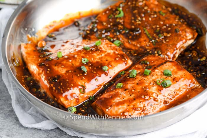 Teriyaki salmon in a bowl with sauce