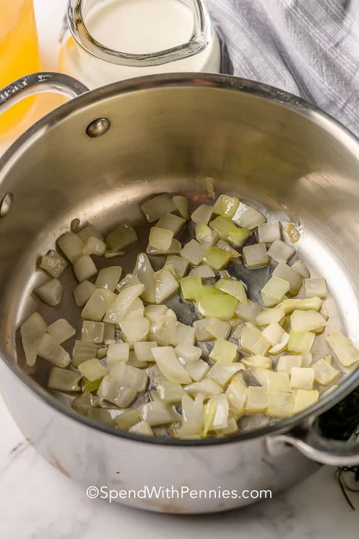 Cooked onions in a pot for Zucchini Soup