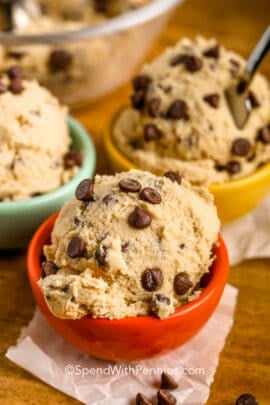 Edible Cookie Dough in a red bowl with other bowls in the background