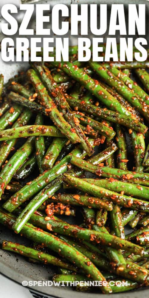Spicy and savory Szechuan Green Beans can be made hot and fresh right at home. Takeout has nothing on these crispy, super tasty veggies. #spendwithpennies #szechuangreenbeans #recipe #sidedish #chinese #spicy #easy #best #healthy #vegan Szechuan Green Beans in the pan with a title