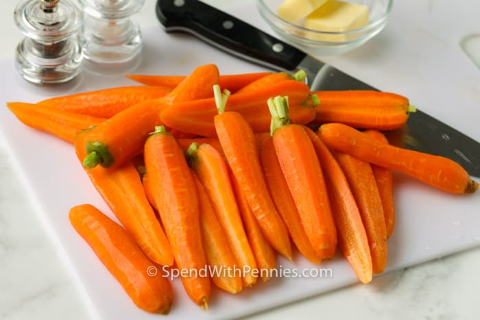 cutting carrots to make Steamed Carrots