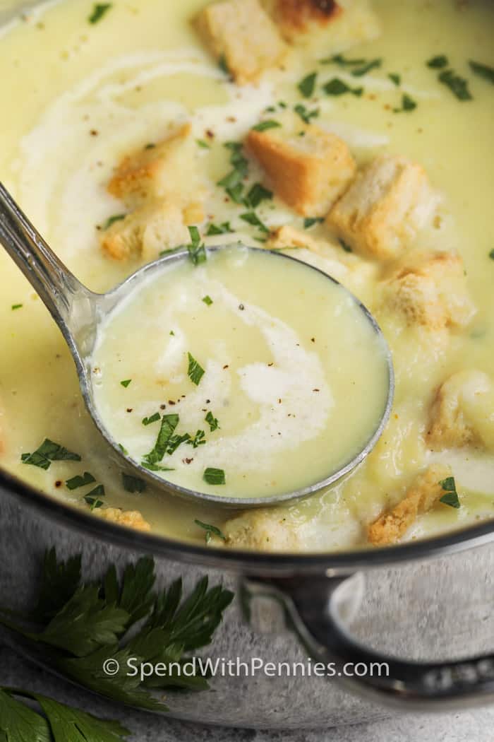 taking a laddle of soup out of a pot of Turnip Soup