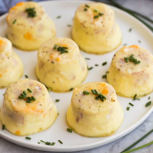 instant pot egg bites on a white plate with chopped chives