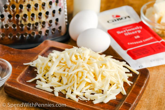 grated cheese on a wooden board for cheese scones 