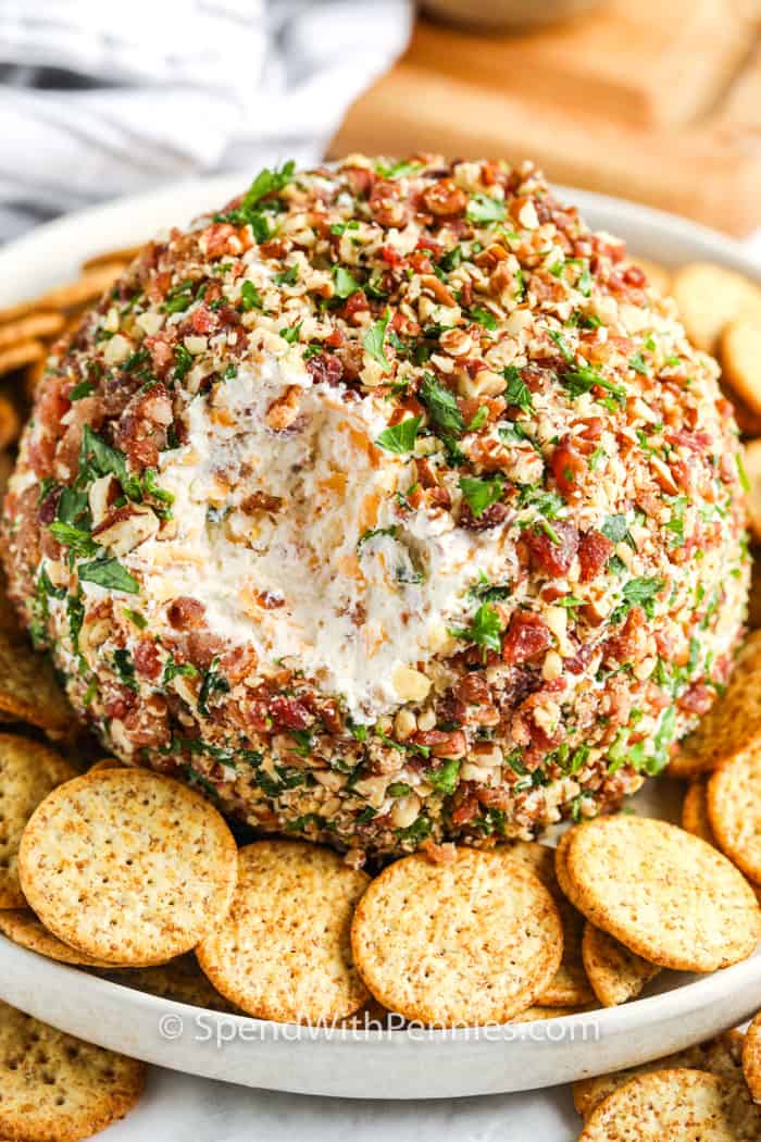 Classic Cheese Ball with crackers on a plate