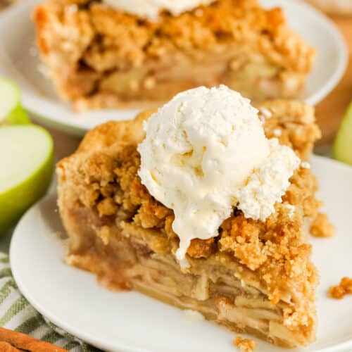 Dutch Apple Pie on a plate with another slice in the background