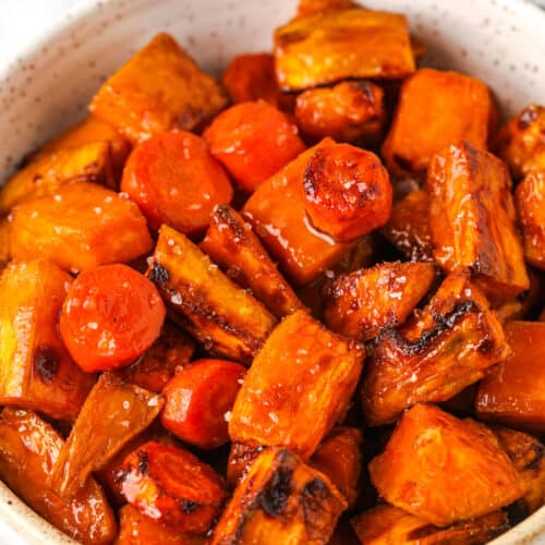 close up of Air Fryer Roasted Sweet Potatoes and Carrots glazed in a bowl