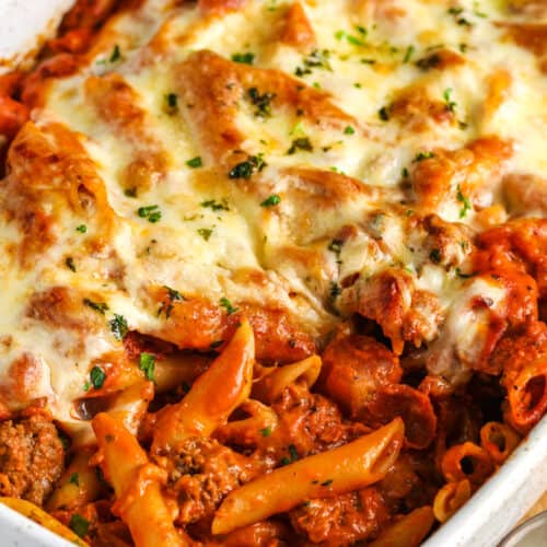 cooked Creamy Baked Mostaccioli in a white casserole dish