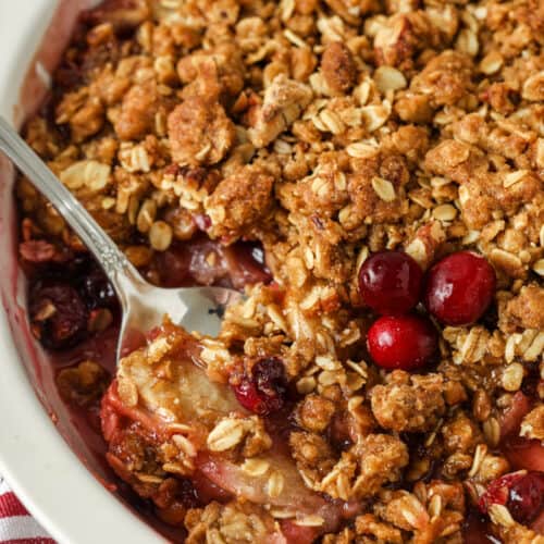 close up of baked Cranberry Apple Crisp with a spoon