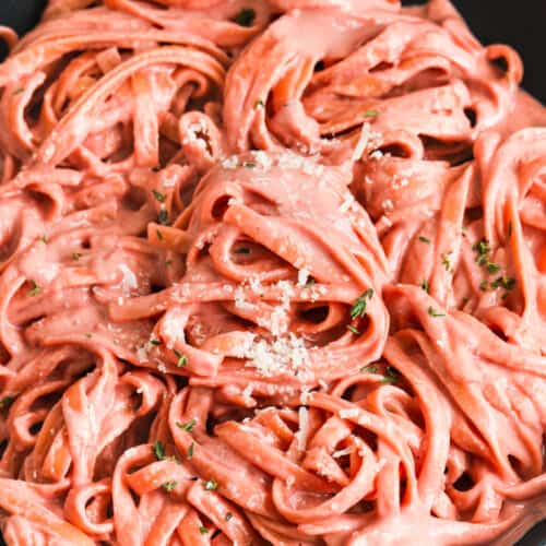 creamy beet pasta in a frying pan