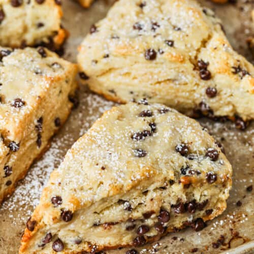 close up of cooked Mini Chocolate Chip Scones on a baking sheet