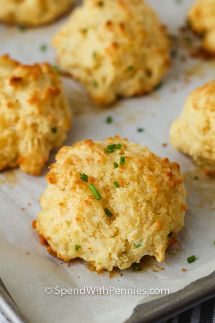 close up of Garlic Drop Biscuits on a baking sheet