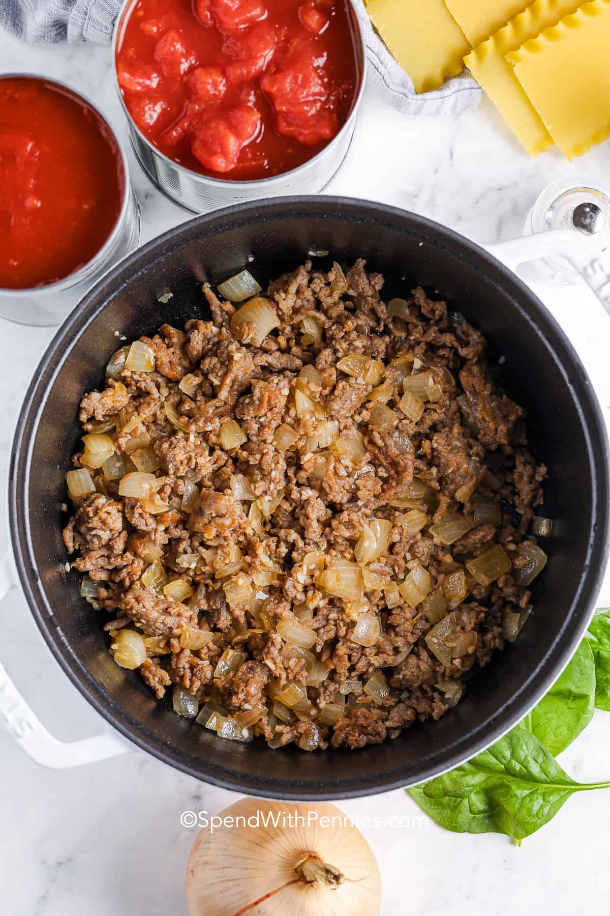 cooked meat in a dutch oven for lasagna soup