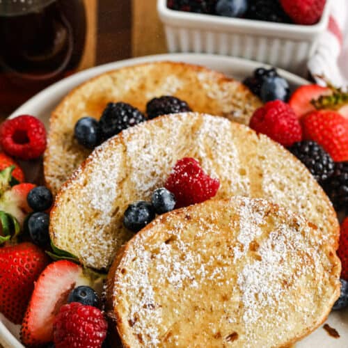 plated Air Fryer French Toast with syrup and icing sugar