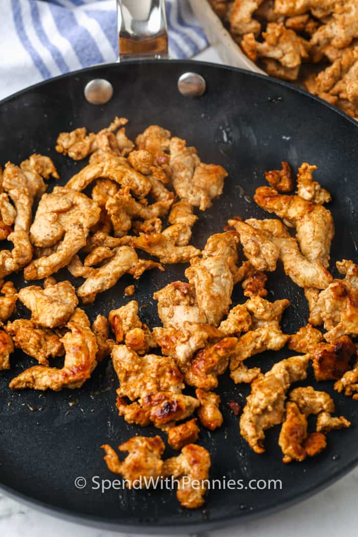 meat cooking in the pan to make Pork Fajitas