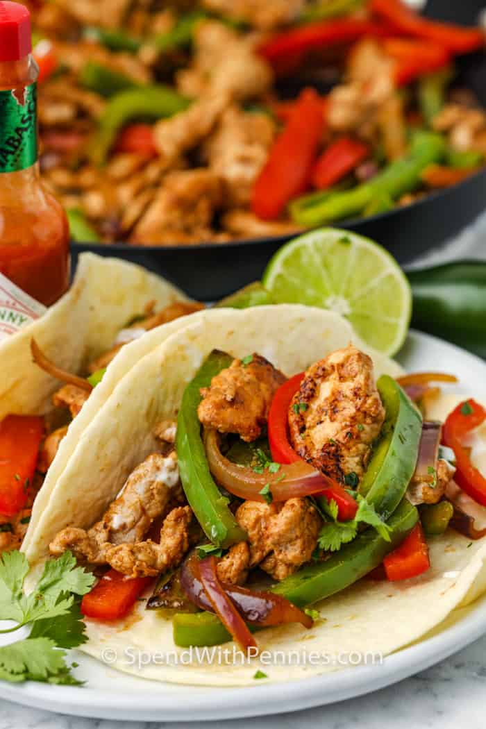 plated Pork Fajitas with pan in the background