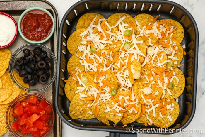 layering Air Fryer Nachos in the air fryer