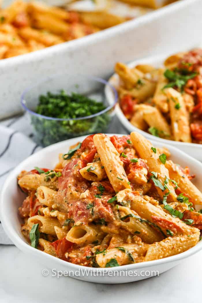 two bowls of Baked Feta Pasta with garnish