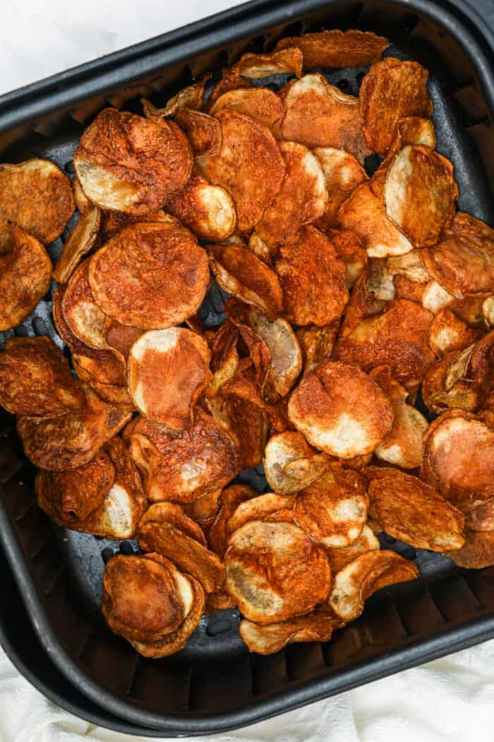 close up of cooked Air Fryer Potato Chips in the air fryer