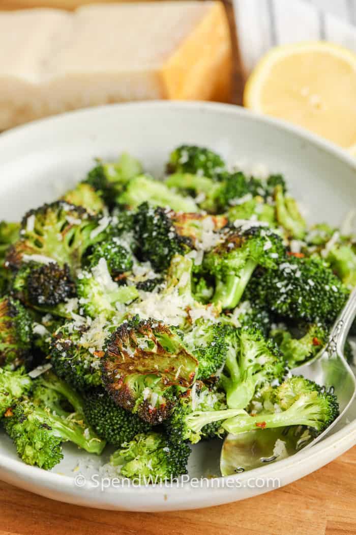 bowl of Oven Roasted Lemon Parmesan Broccoli with a spoon