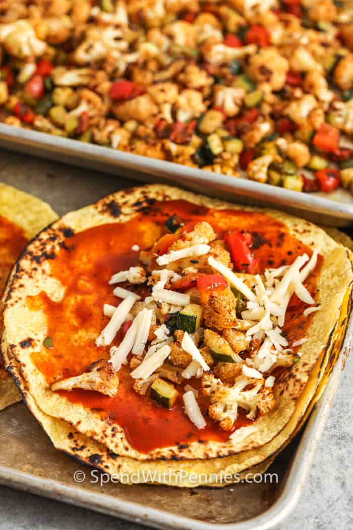 Veggie Enchiladas open with filling on a baking sheet