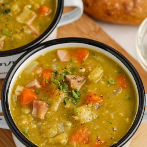 close up of Instant Pot Split Pea Soup in bowls with bread
