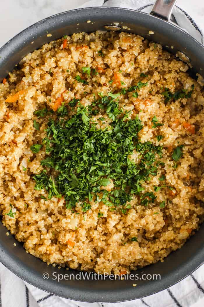 Quinoa pilaf in a pan with parsley 