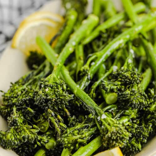 Air Fryer Broccolini on a plate with lemon