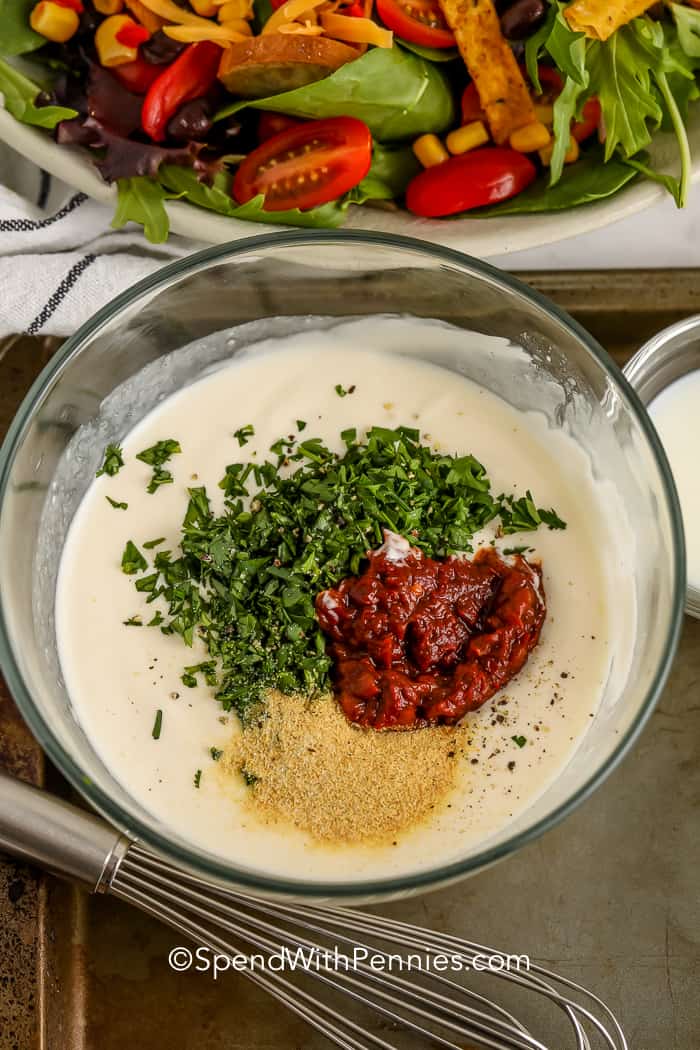 ingredients for chipotle ranch dressing in a glass bowl