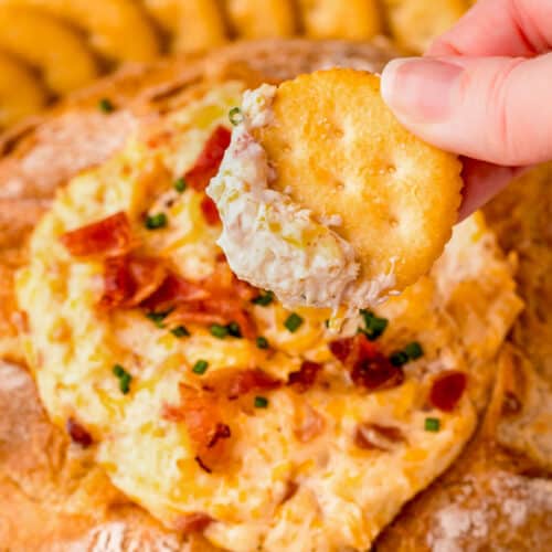 a cracker being dipped in Mississippi Sin Dip