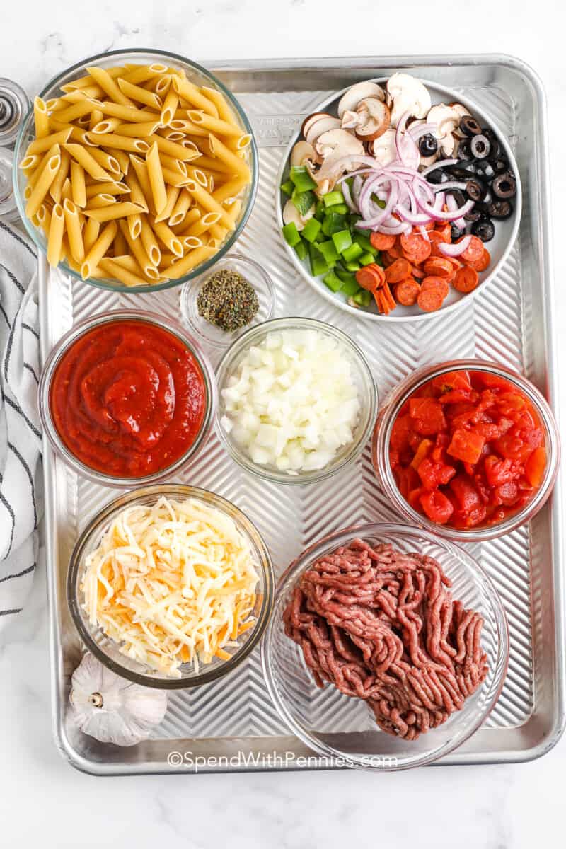 For this pizza casserole, it's best to cook the pasta al dente since it will cook more in the oven.
Be sure to cook toppings like mushrooms or pineapple. If you don't like chunks of tomato in a casserole, swap the diced tomato with crushed tomato and simmer to thicken for an extra 5 minutes. This recipe is super versatile so customize it with your favorite mix-ins, or make ingredient changes. #pizzacasserole #supremepizzacasserolerecipe #supremepizza #spendwithpennies ingredients for a baked supreme pizza casserole