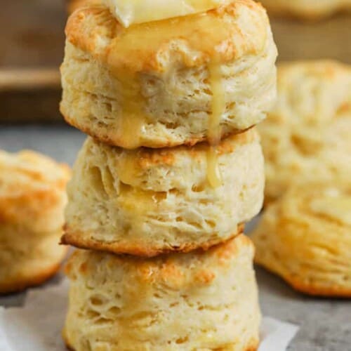 Buttermilk Biscuits in a pile with butter and honey