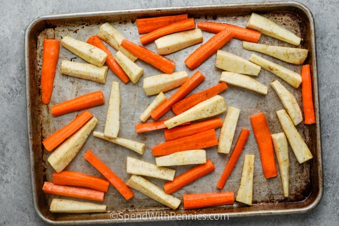 Carrots and Parsnips on a baking sheet before cooking