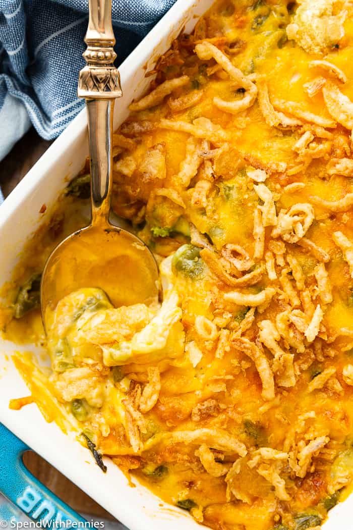 a spoon in a cheesy vegetable casserole