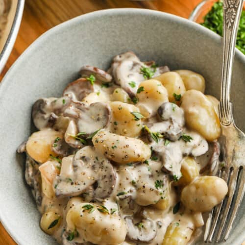 Creamy Mushroom Gnocchi in a bowl with a fork