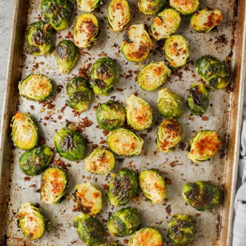 top view of cooked Crispy Roasted Brussels Sprouts on a baking sheet