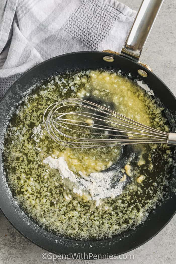 sauteeing garlic in a pan