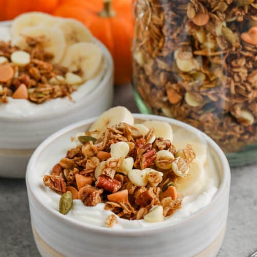 plated Pumpkin Spice Granola with jar full in the back