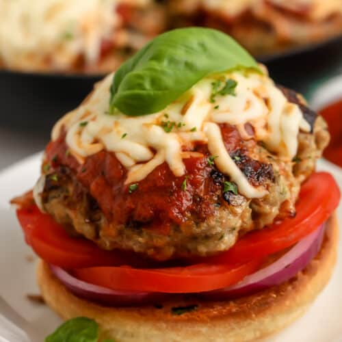 Chicken Parmesan Burgers on a bun with vegetables