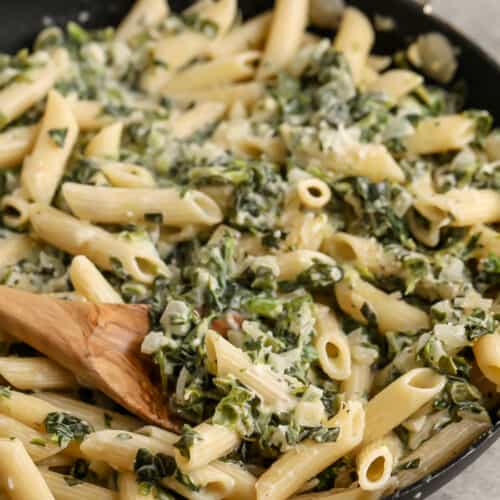 close up of Quick & Creamy Spinach Pasta with a spoon