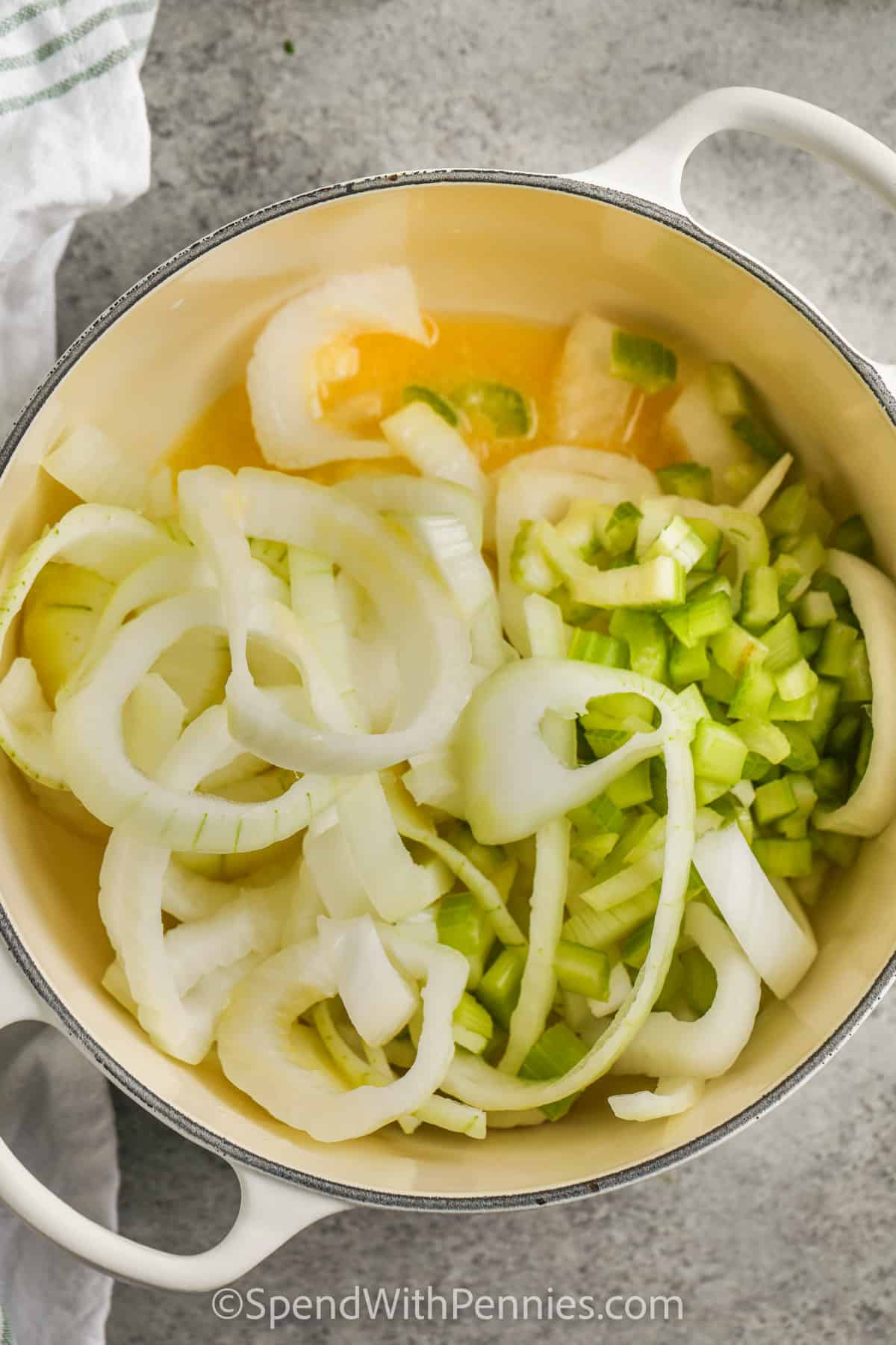 onions and celery in a pot to make Cream of Onion Soup