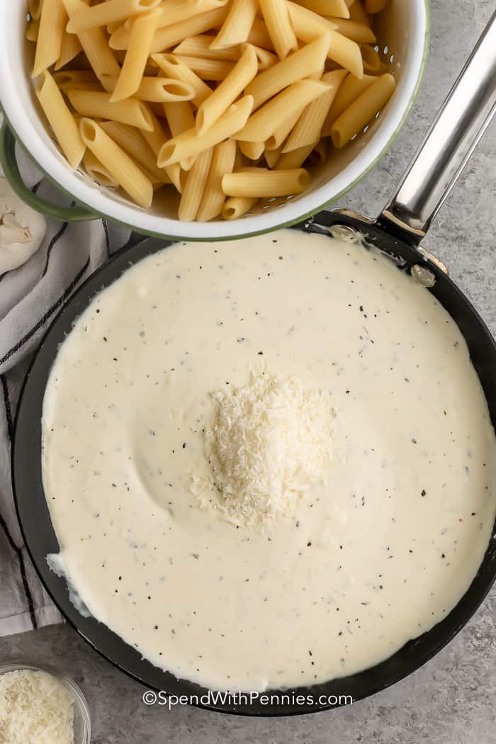 finished Cream Cheese Pasta Sauce in the pan with cheese