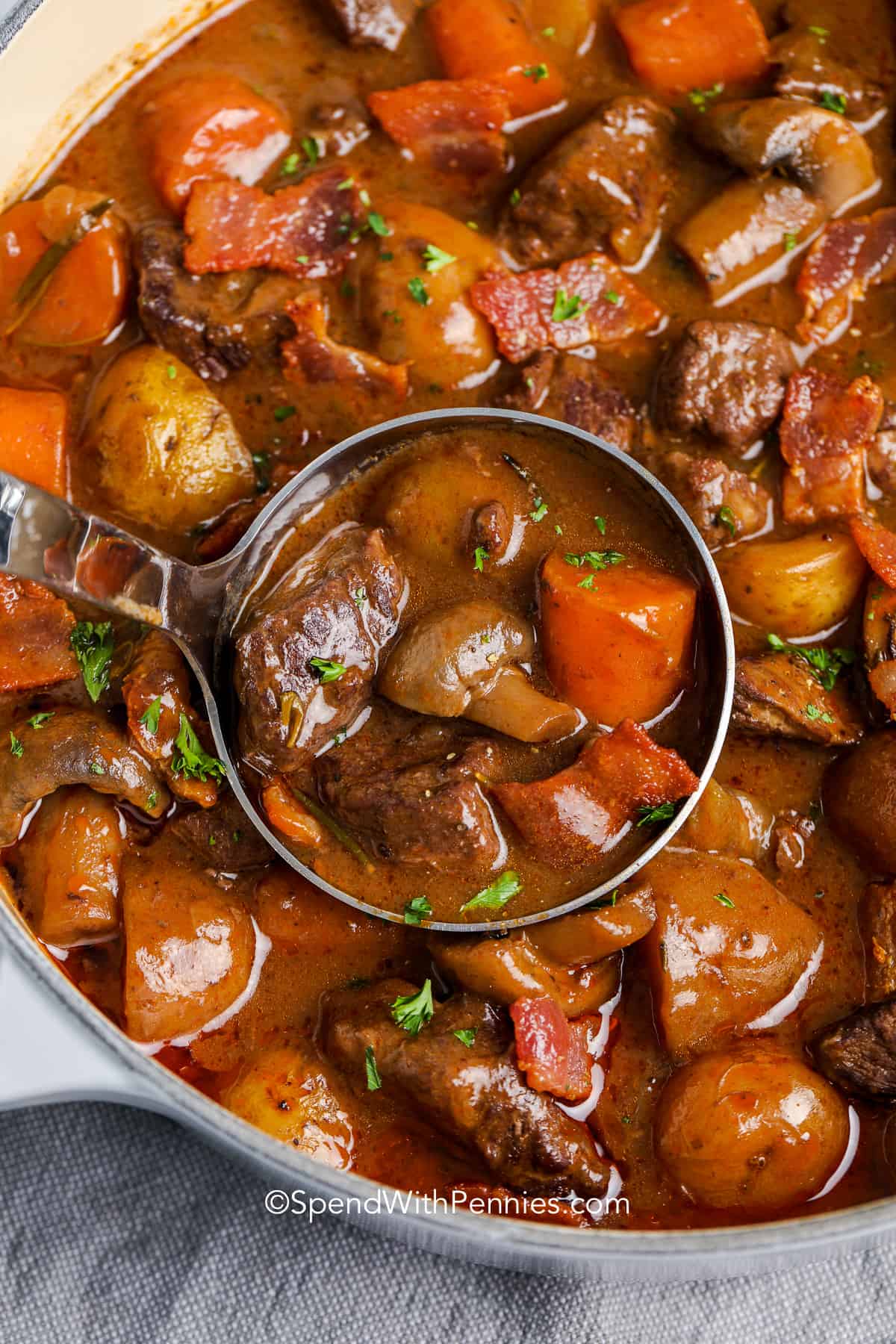 a ladle of Beef Bourguignon
