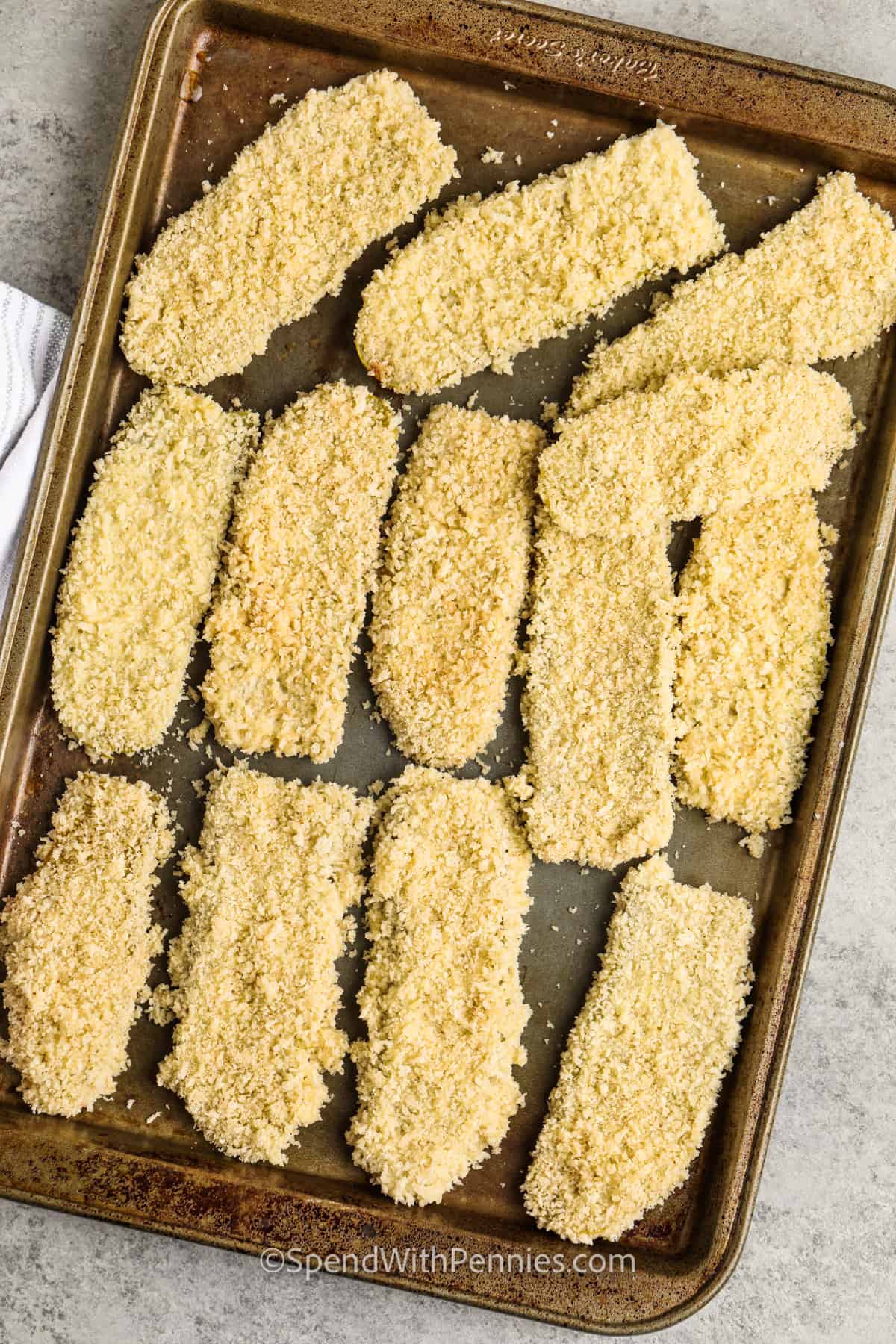 Fried pickles bring together the crunch of dill pickles and the crisp golden coating of a classic fried recipe. Pickle slices are dipped in a seasoned batter and coated with Panko crumbs for the best crunch. Serve them with ranch dip, a spicy sauce, or alongside chicken tenders for the ultimate snack platter. Make them as chips for easy snacking or as spears for extra pickle flavor in each bite. However you serve them, fried pickles are a favorite. #spendwithpennies Crispy Fried Dill Pickles before cooking