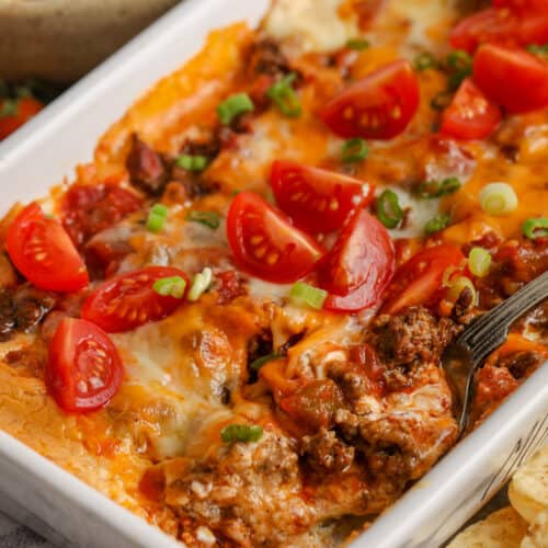 close up of Hot & Cheesy Taco Dip with a spoon