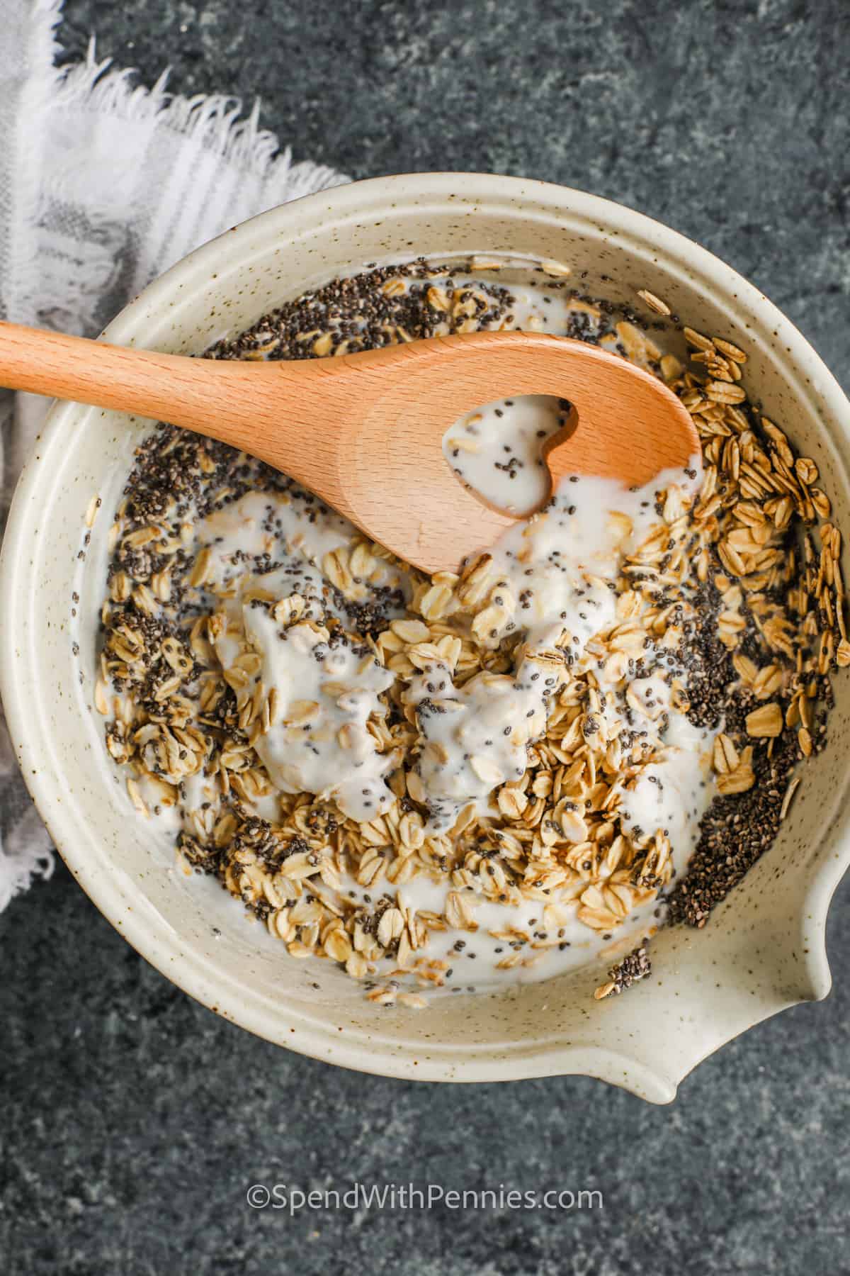 This healthy Overnight Oats recipe is high in fiber and healthy, made with steel-cut Quaker oats and any kind of milk, from almond to full-fat dairy. There are so many options for add-ins and flavors. Try it with bananas and peanut butter for a sweet treat, or open a jar of strawberry or blueberry jam and mix it in. It's an easy breakfast that can be customized. #overnightoats #recipehealthy #recipeeasy #spendwithpennies plated Overnight Oats