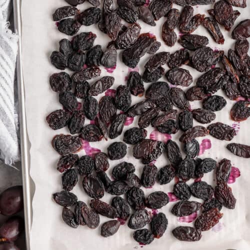 Raisins baked on a parchment lined baking sheet