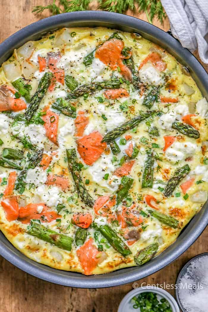 Frittata in a pan with asparagus and salmon