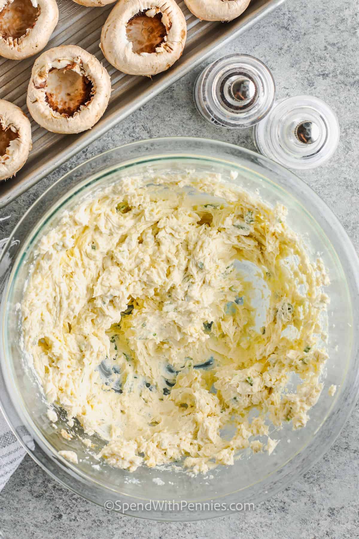 Homemade stuffed mushrooms will be the appetizer hit at the next party. It is so easy to make this delicious recipe. Simply stuff some small white mushrooms with a filling of cream cheese and spices. Then top them with some breadcrumbs and parmesan cheese, then bake until perfectly golden. And voila, an appetizer is made! #stuffedmushrooms #easystuffedmushrooms #appetizer #spendwithpennies filling to make Stuffed Mushrooms