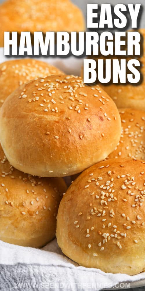Make these homemade hamburger buns so easily at home. These soft and fluffy buns are so irresistible served warm from the oven. Guests will simply adore these buttery brioche buns. Chicken burgers, beef burgers, pulled pork, or even sloppy joes will all get an upgrade if they're served with these homemade buns! #hamburgerbuns #homemadehamburgerbuns #briochehamburgerbuns #spendwithpennies close up of Hamburger Buns with writing